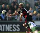 Justin Marshall of Saracens is held by Leicester's Sam Vesty