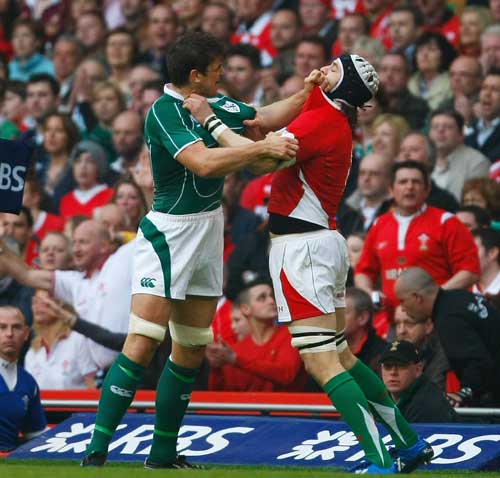 Donncha O'Callaghan of Ireland gets to grips with Ryan Jones of Wales during the opening exchanges