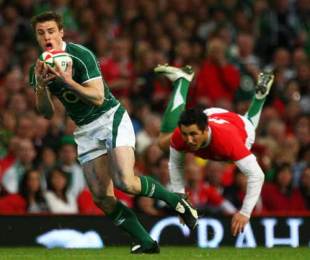 Tommy Bowe of Ireland escapes Gavin Henson on the way to his try