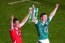 Ireland's Ronan O'Gara and Brian O'Driscoll celebrate their team's Grand Slam victory