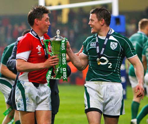 Ireland's Ronan O'Gara and Brian O'Driscoll celebrate their team's Grand Slam victory