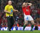 Wales' Stephen Jones looks on in disbelief as his penalty kick drops short 
