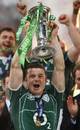 Ireland captain Brian O'Driscoll holds the Six Nations trophy aloft
