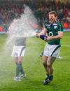Ireland's Gordon D'Arcy sprays team mate Paddy Wallace with champagne