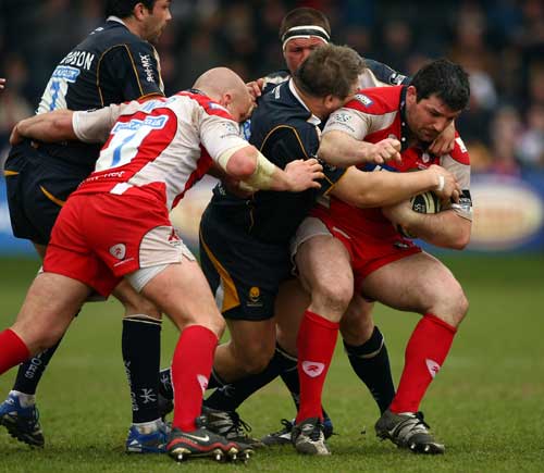 Gloucester's Olivier Azam is tackled by the Worcester defence