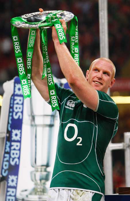 Ireland lock Paul O'Connell lifts the Triple Crown trophy