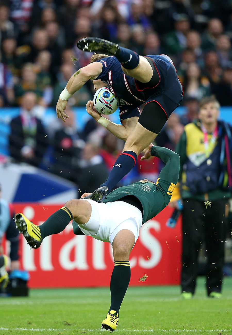 Bryan Habana of South Africa collides with Blaine Scully of the United States