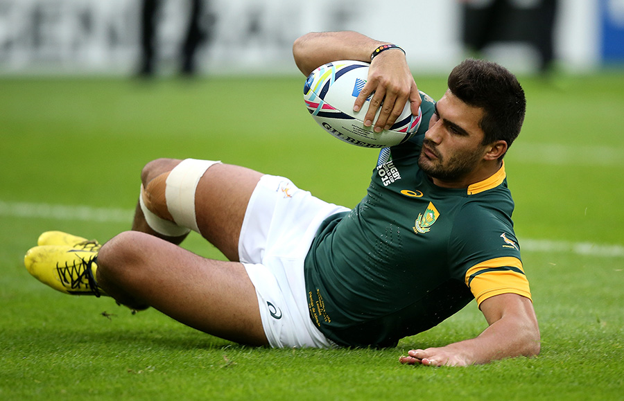 Damien de Allende of South Africa goes over for the opening try