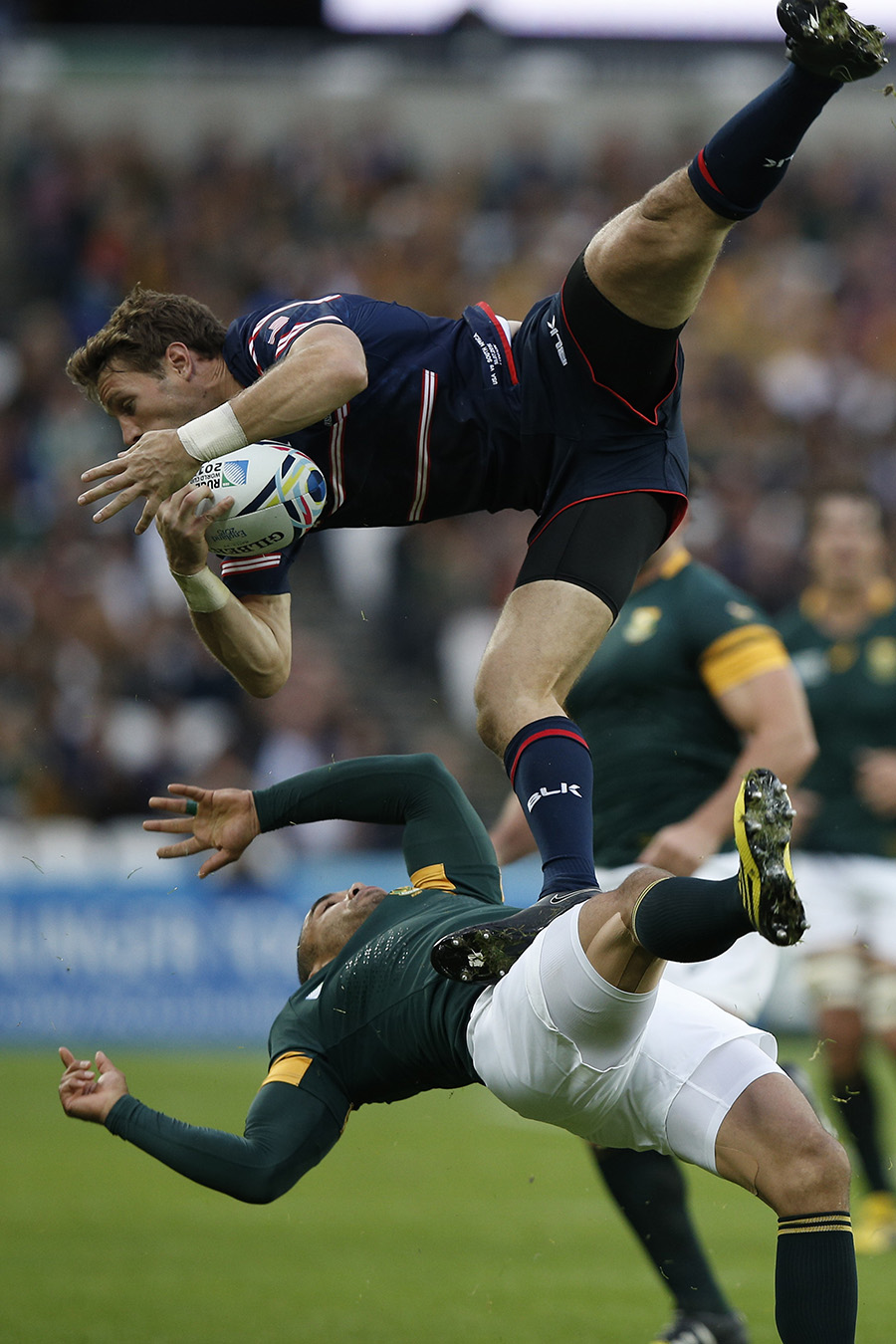 Bryan Habana of South Africa collides with Blaine Scully of the United States