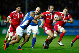 EXETER, ENGLAND - OCTOBER 07: Tamaz Mchedlidze of Georgia hands off Russel Van Wyk of Namibia during the 2015 Rugby World Cup Pool C match between Namibia and Georgia at Sandy Park on October 7, 2015 in Exeter, United Kingdom. (Photo by Laurence Griffiths/Getty Images)