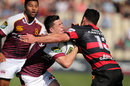 Mike Molloy of Southland is tackled by Ryan Crotty of Canterbury 