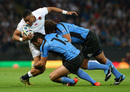 Anthony Watson of England is tackled by Joaquin Prada of Uruguay