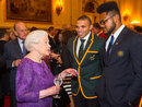 Queen Elizabeth II and Prince Philip, Duke of Edinburgh with South Africa's Bryan Habana and Australia's Henry Speight  at a Rugby World Cup reception at Buckingham Palace