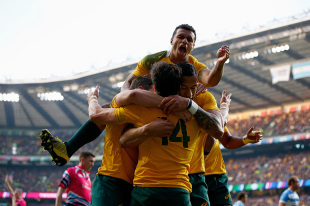 LONDON, ENGLAND - OCTOBER 25:  Adam Ashley-Cooper of Australia celebrates with teammates after scoring his sides second try during the 2015 Rugby World Cup Semi Final match between Argentina and Australia at Twickenham Stadium on October 25, 2015 in London, United Kingdom.  (Photo by Dan Mullan/Getty Images)
