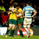 Australia's Adam Ashley-Cooper celebrates with teammates after scoring his third try