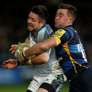 Mike Delaney of Newcastle is tackled by Alex Grove of Worcester during the Aviva Premiership match between Worcester Warriors and Newcastle Falcons at Sixways Stadium on November 7, 2015 in Worcester, England. (Photo by Ben Hoskins/Getty Images)