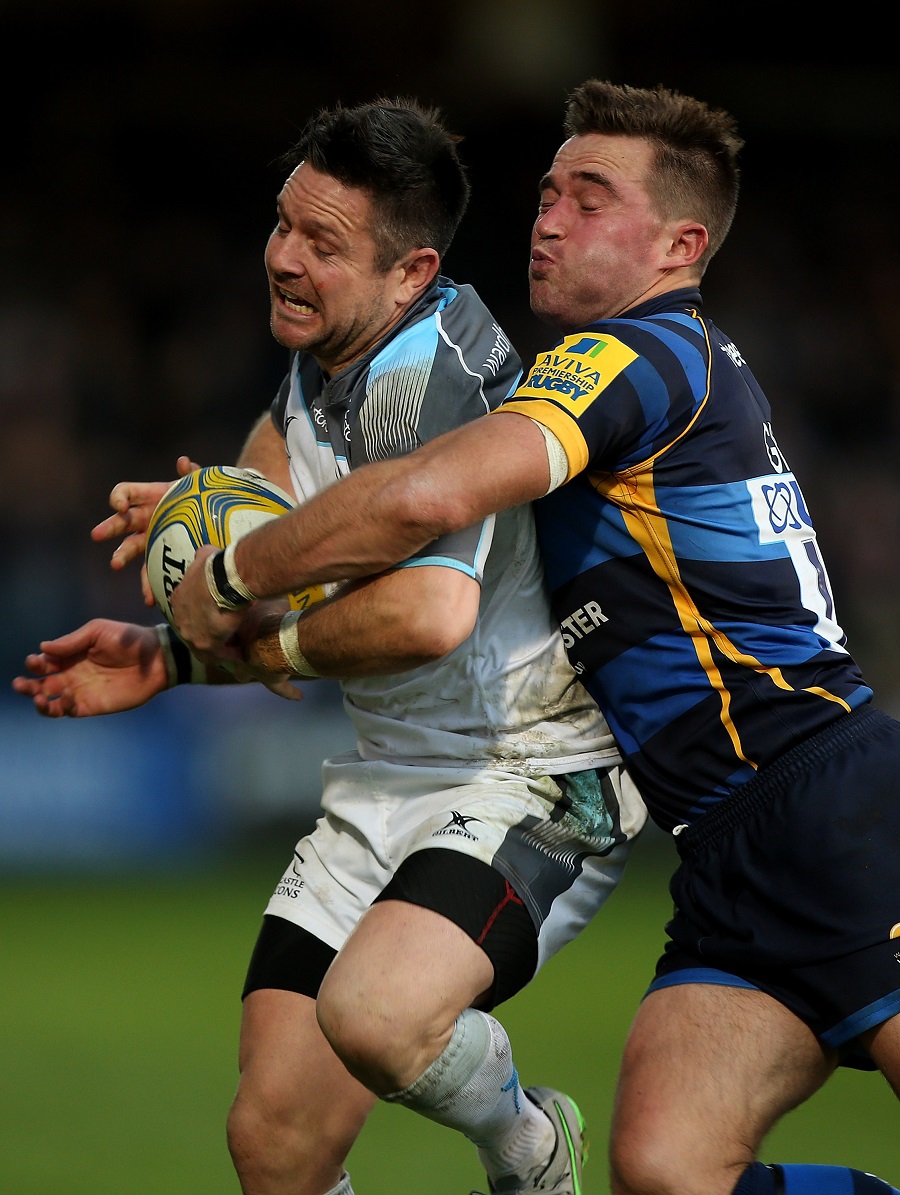 Mike Delaney of Newcastle is tackled by Alex Grove of Worcester