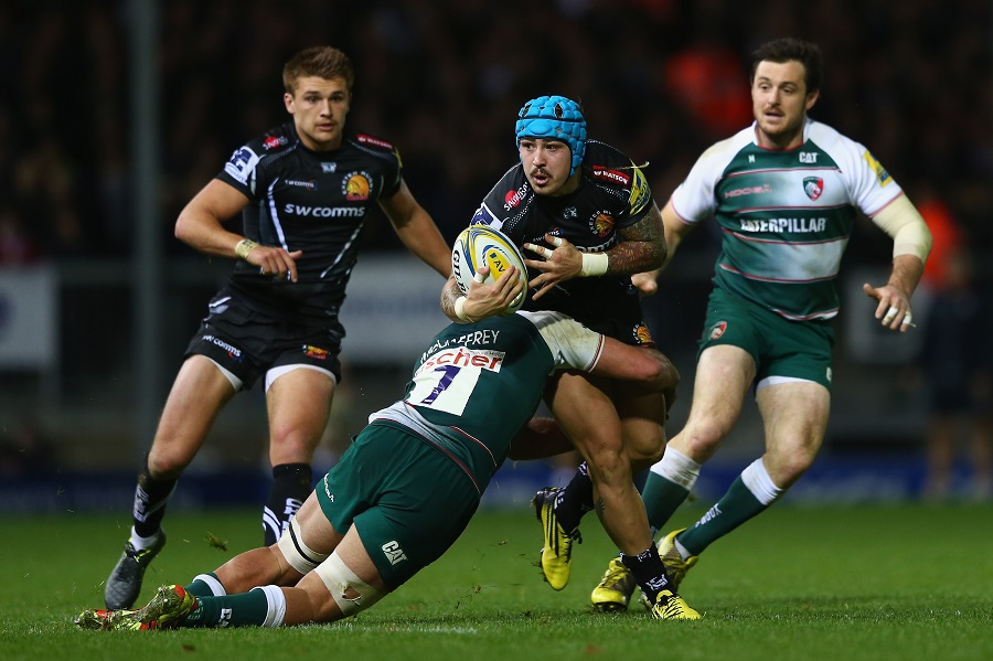 Jack Nowell of Exeter Chiefs looks for support as Lachlan McCaffreey of Leicester Tigers holds on 
