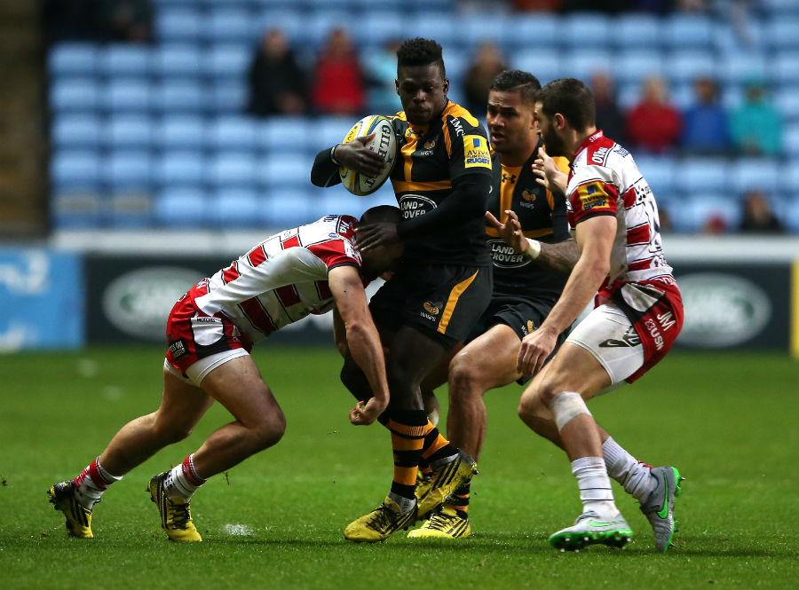 Christian Wade of Wasps is stopped by the Gloucester defence