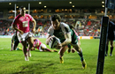 Matt Smith dives over to score a try during