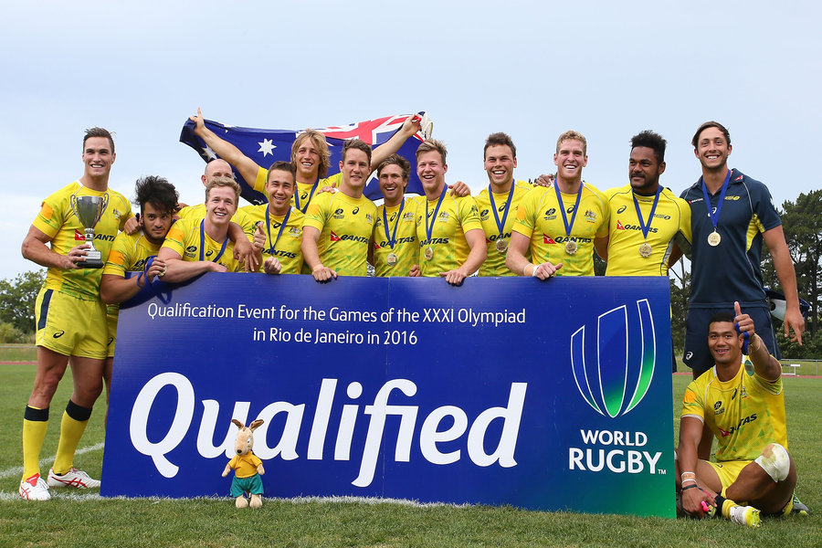 Australian players celebrate after winning the World Sevens Oceania Olympic Qualification Final between Australia and Tonga