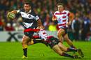 Ryan Crotty beats the tackle of Gloucester's Mat Protheroe