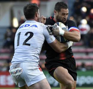 Toulouse's New Zealand fly-half Luke McAlister breaks away Oyonnax' Irish centre Eamonn Sheridan from during the European Rugby Union Champions Cup match Toulouse against Oyonnax November 21, 2015 at the Ernest Wallon Stadium in Toulouse, southwestern France. AFP PHOTO / PASCAL PAVANI (Photo credit should read PASCAL PAVANI/AFP/Getty Images)