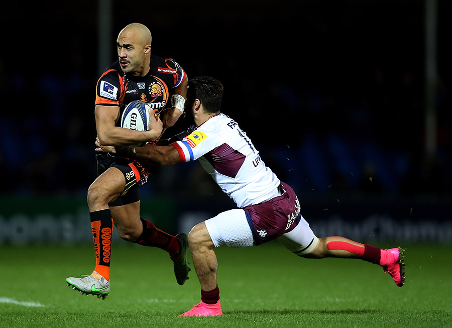 Olly Woodburn of Exeter is tackled by Julien Rey of Bordeaux-Begles