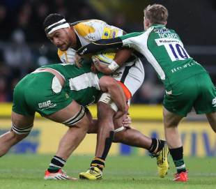 Nathan Hughes of Wasps is tackled by Joe Trayfoot (L) and Chris Noakes during the Aviva Premiership match between London Irish and Wasps at Twickenham Stadium on November 28, 2015 in London, England.  