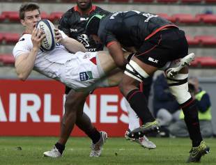 Toulouse's French flanker Thierry Dusautoir (R) vies with Ulster's wing Andrew Trimble (L) during the European Rugby Union Champions Cup rugby match Toulouse against Ulster December 20, 2015 at the Ernest Wallon Stadium in Toulouse , southwestern France. AFP PHOTO / PASCAL PAVANI 