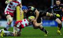 Julian Salvi of Exeter Chiefs is tackled by Matt Kvesic