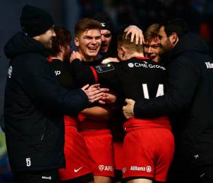 Owen Farrell is congratulated by his Saracens team-mates during the European Rugby Champions Cup match between Saracens and Ulster Rugby at Allianz Park on January 16, 2016 in Barnet, England. (Photo by Jordan Mansfield/Getty Images)