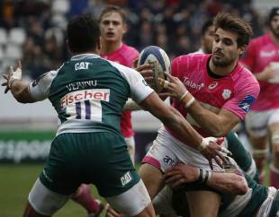 Stade Francais' French fullback Hugo Bonneval (R) vies for the ball during the European Champions Cup rugby union match between Stade Francais and Leicester Tigers, on January 24, 2016, at the Jean Bouin stadium in Paris. 
