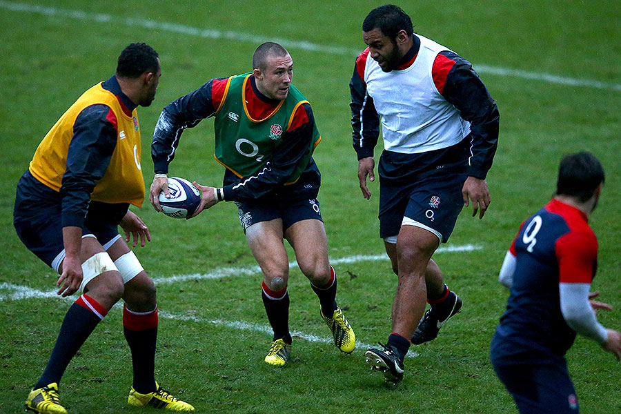 England's Mike Brown looks to pass at training