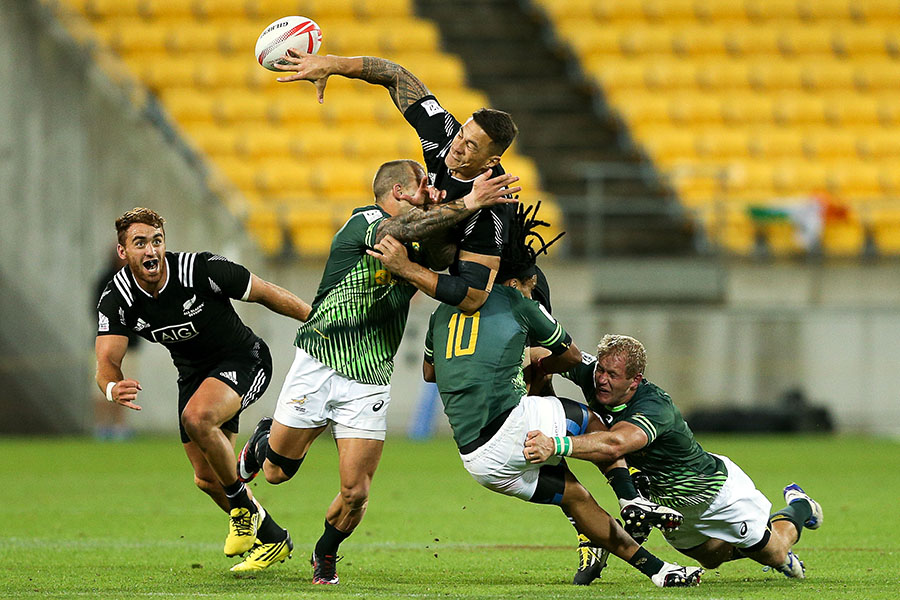 New Zealand's Sonny Bill Williams is tackled by three Blitzbok defenders during their Pool A