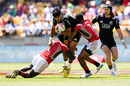 Rieko Ioane of New Zealand is tackled during the 2016 Wellington Sevens bowl quarter-final 