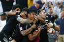 Rieko Ioane of New Zealand is congratulated after scoring the match-winning try in the Sydney 7s Cup final