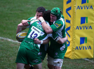 Ciaran Hearn of London Irish celebrates with team mates after he slips the tackle from Worcester's Phil Dowson to score the first try of the game during the Aviva Premiership match between London Irish AND Worcester Warriors at The Madejski Stadium on February 07, 2016 in Reading, England. (Photo by Charlie Crowhurst/Getty Images)