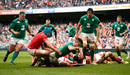 Conor Murray of Ireland crashes through the tackle from Justin Tipuric of Wales to score the opening try