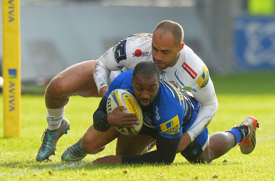 Neville Edwards of Sale Sharks tackled by Olly Woodburn of Exeter Chiefs