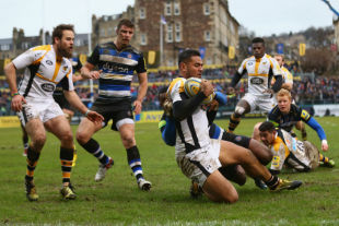 Frank Halai of Wasps scores his side's opening try despite the challenge from Semesa Rokoduguni of Bath during the Aviva Premiership match between Bath and Wasps at the Recreation Ground on February 20, 2016 in Bath, England. (Photo by Michael Steele/Getty Images)