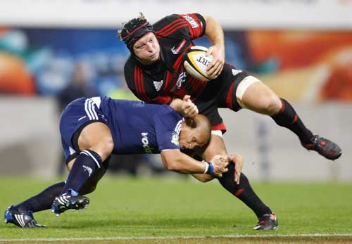 The Crusaders' Thomas Waldrom is tackled by the Stormers' Ricky Januarie