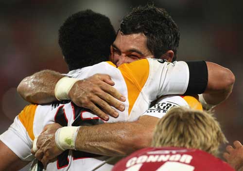 The Chiefs' Mils Muliaina is congratulated by team mate Stephen Donald