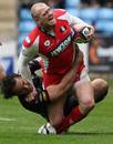 Gloucester's Mike Tindall is injured as he is tackled by the Ospreys' Sonny Parker