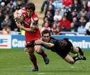 Gloucester's Anthony Allen is tackled by the Ospreys' Andrew Bishop