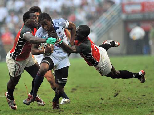 The United States' Justin Boyd is tackled by the Kenya defence