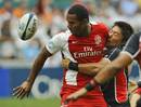 England's Josh Drauniniu passes the ball out of a tackle