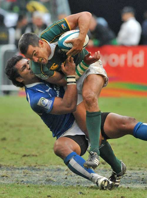 South Africa's Neil Powell takes on the Samoa defence