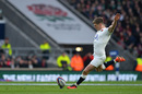 England's centre Owen Farrell kicks a penalty