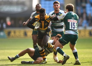 COVENTRY, ENGLAND - MARCH 12: Christian Wade of Wasps is tackled by Mathew Tait of Leicester Tigers during the Aviva Premiership match between Wasps and Leicester Tigers at The Ricoh Arena on March 12, 2016 in Coventry, England.